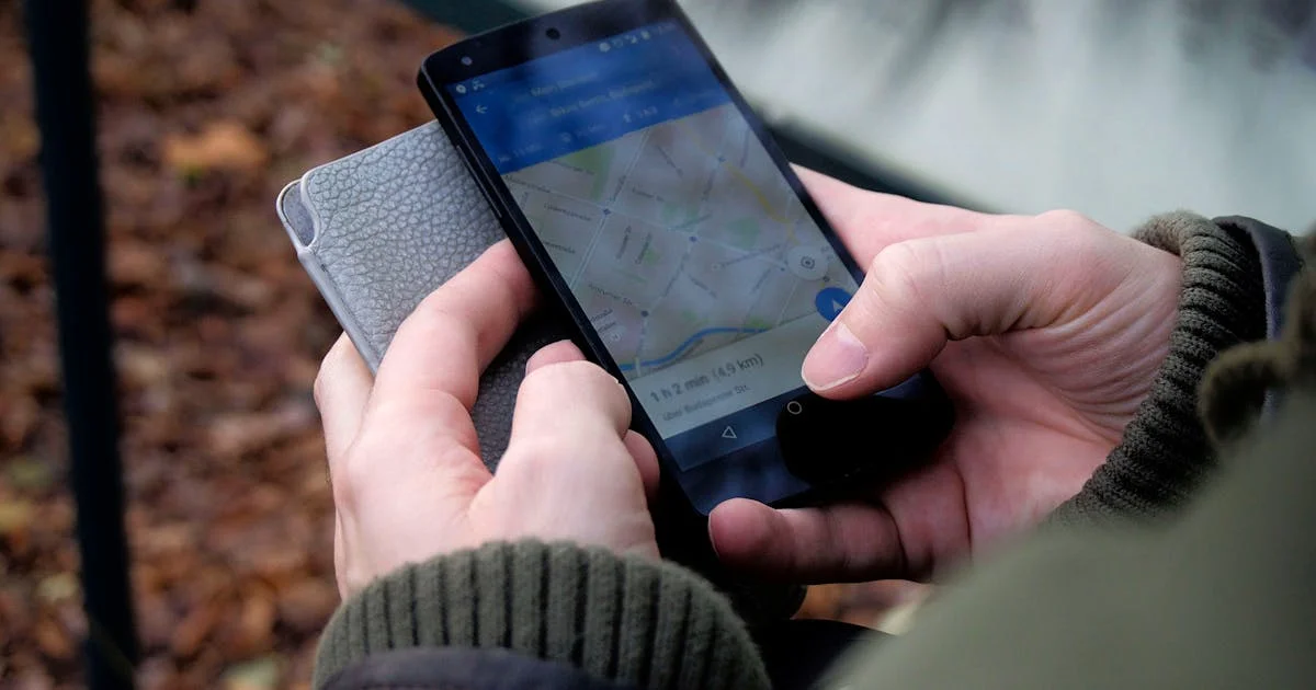 Person using Google Maps on a smartphone to find a local contractor